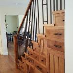 Custom cabinetry under stairs.